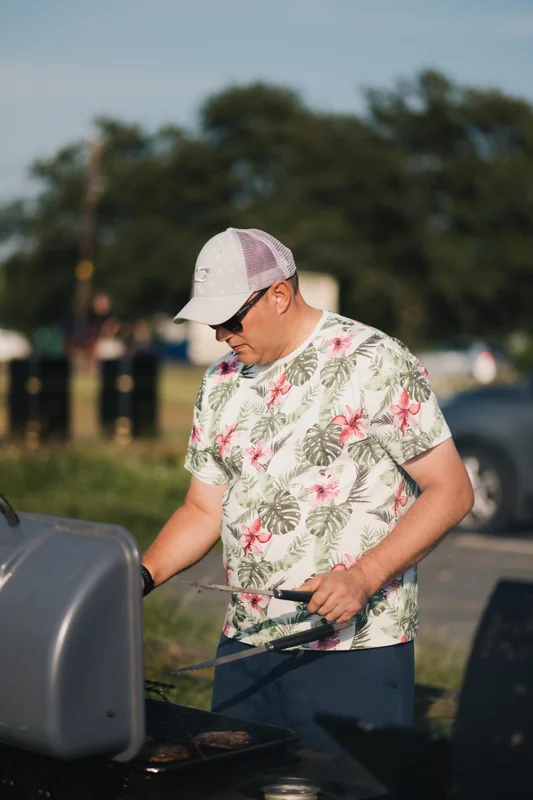 a man grilling on a bbq