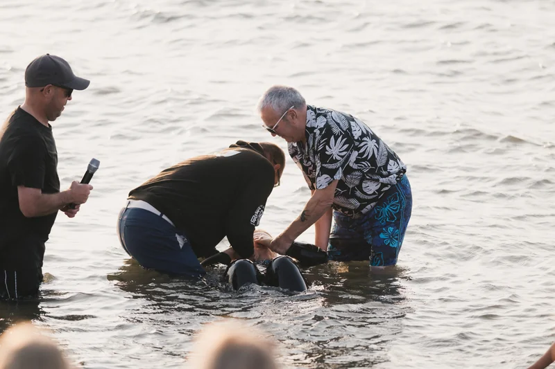christian baptism of a baby in the water