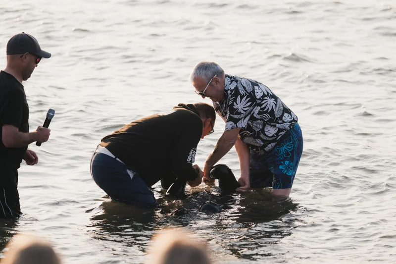 christian baptism of a baby in the water
