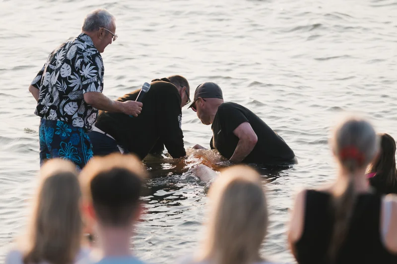 christian baptism of a baby in the water