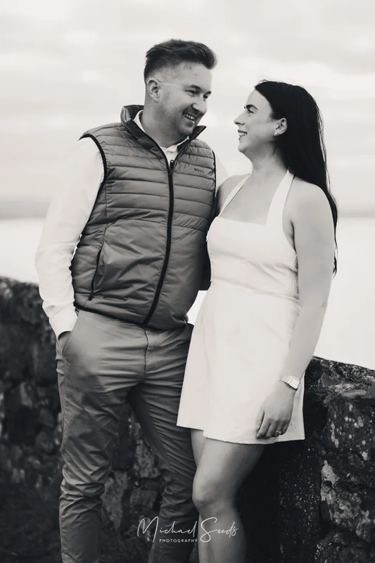 a bride and groom pose for an engagement photo shoot in ireland
