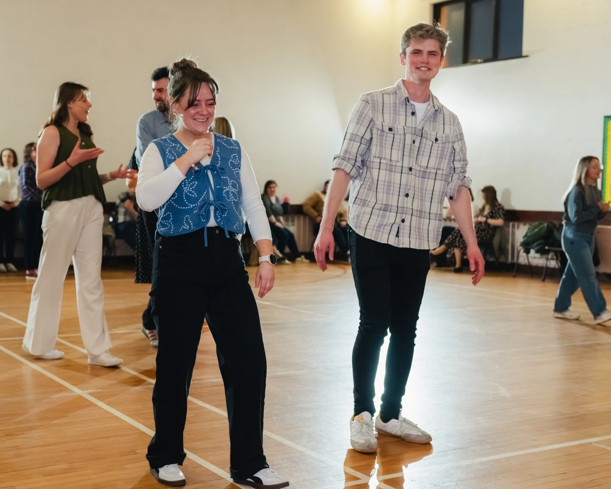 a group of people dancing in a dance floor