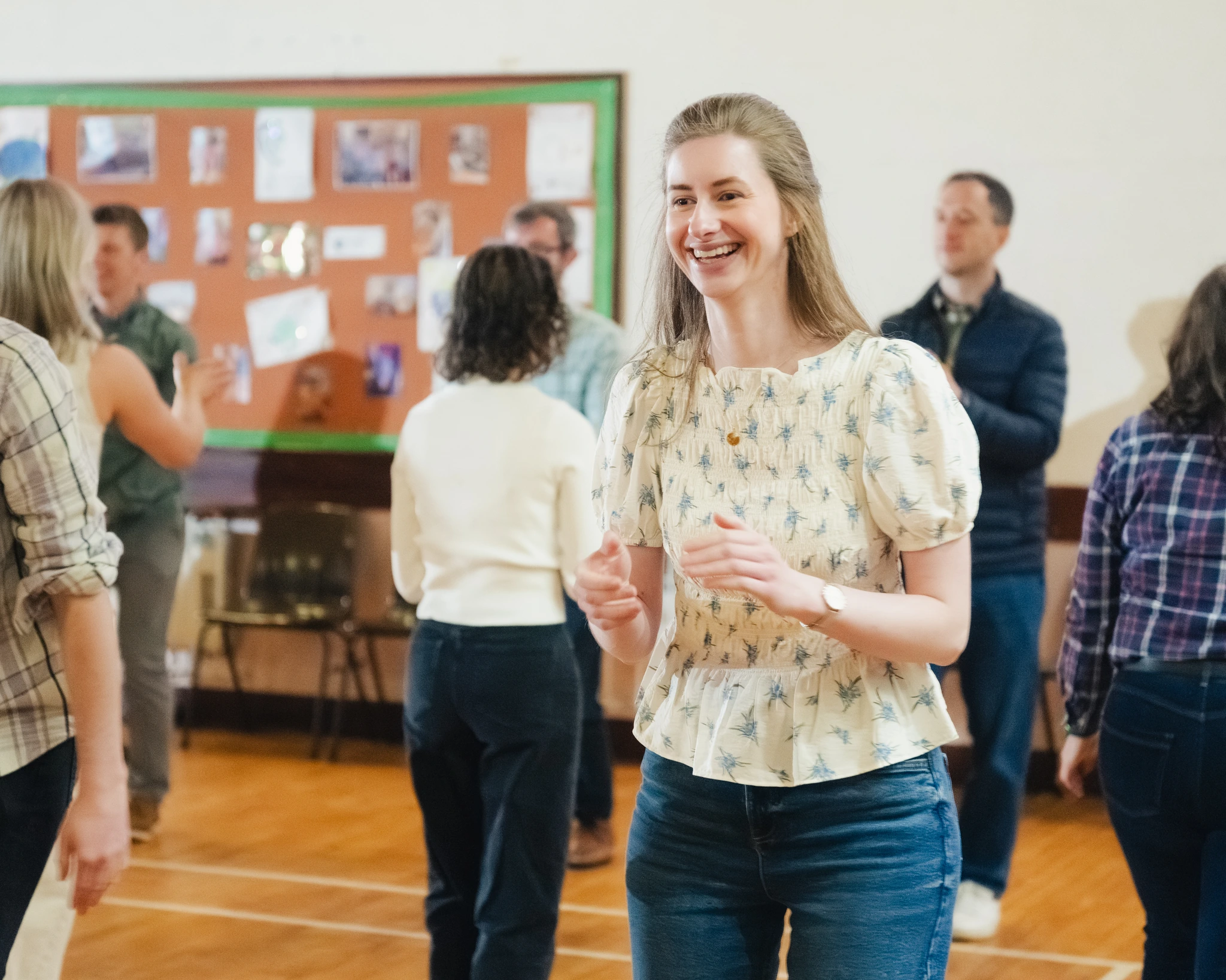 a group of people dancing in a room