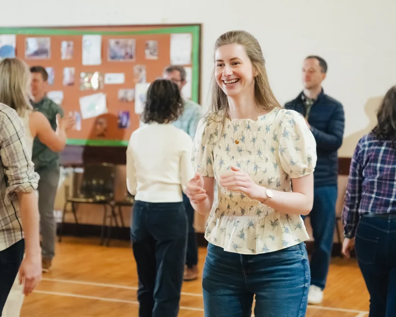 a group of people dancing in a room