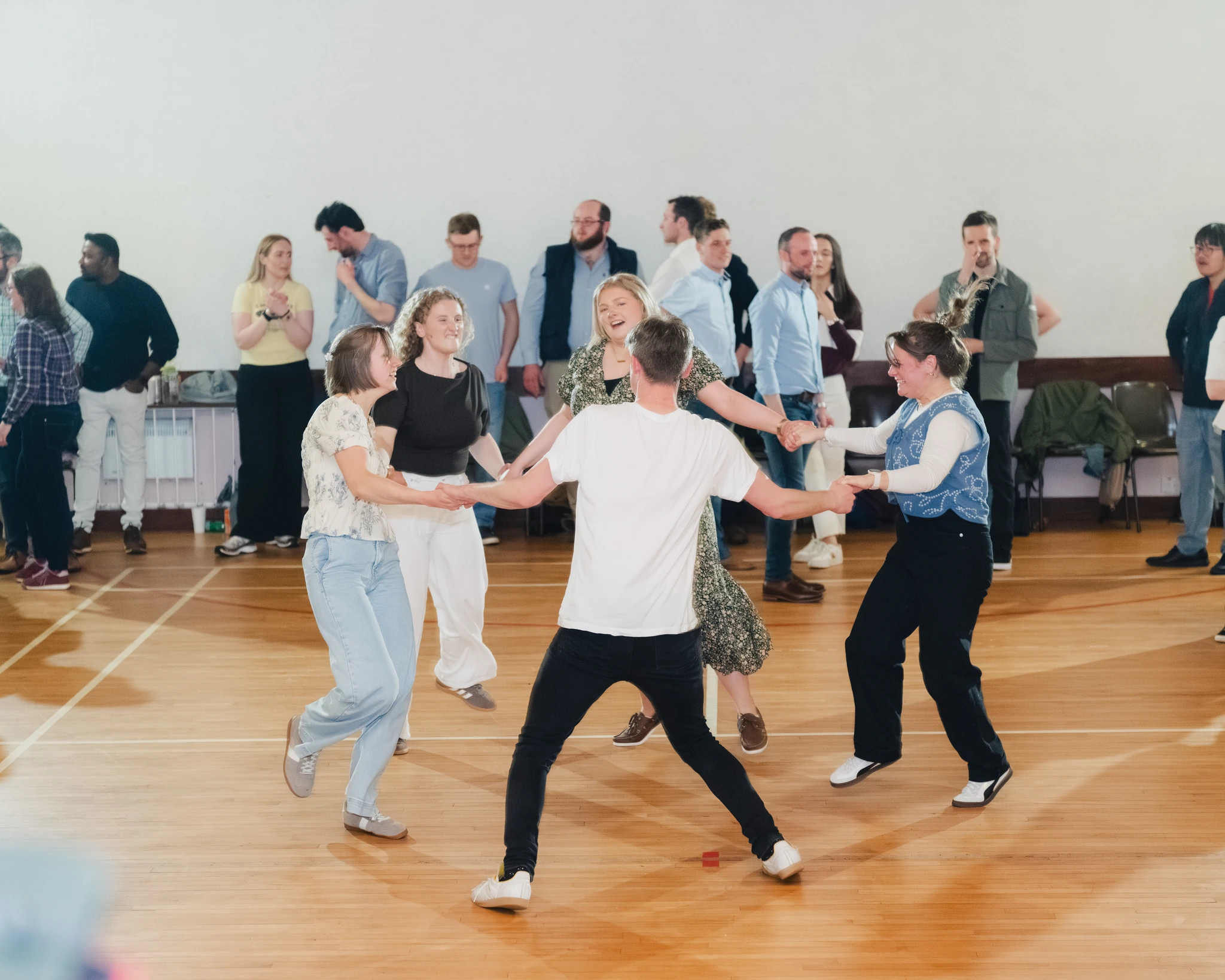 a group of people dancing in a room