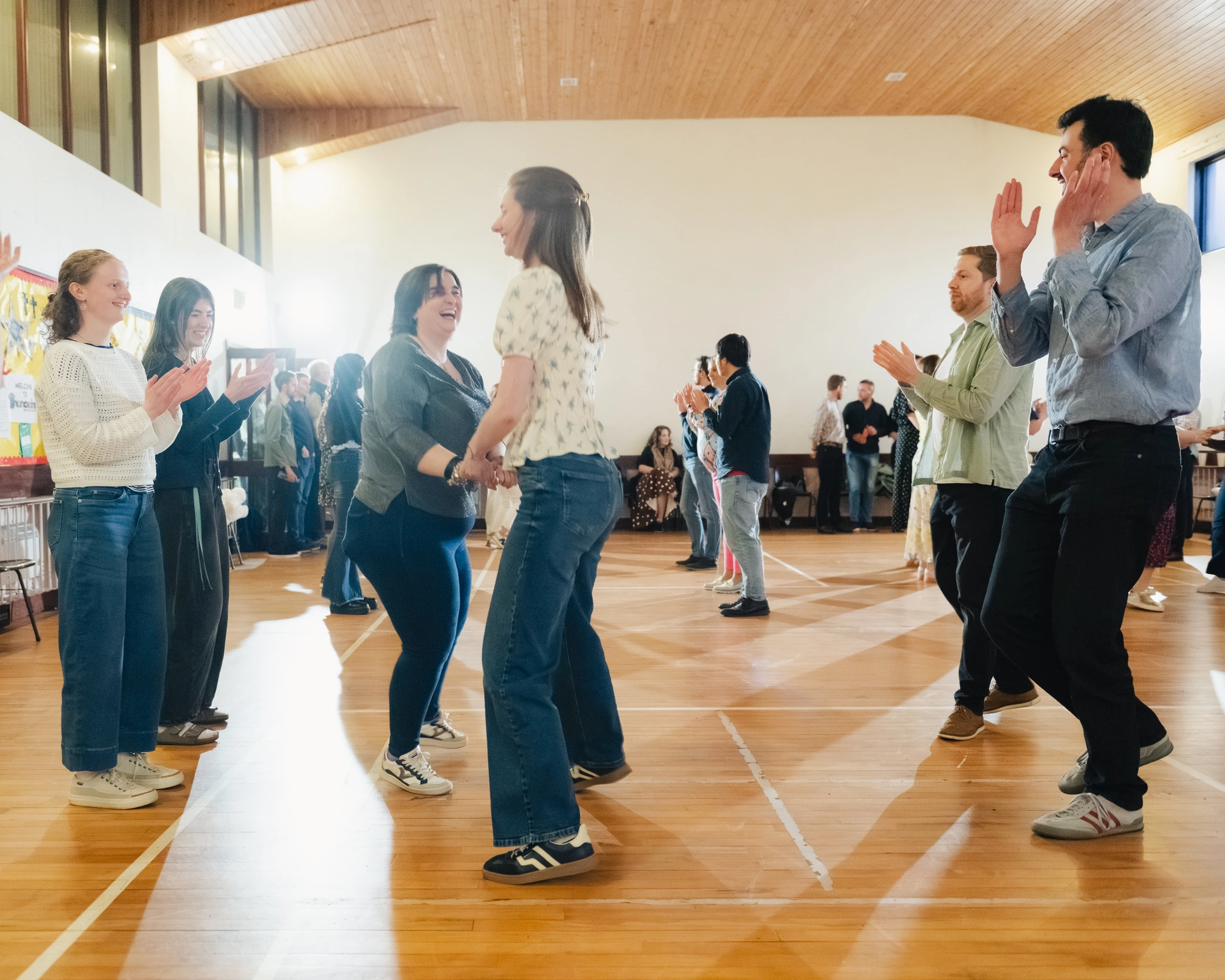 a group of people dancing in a room