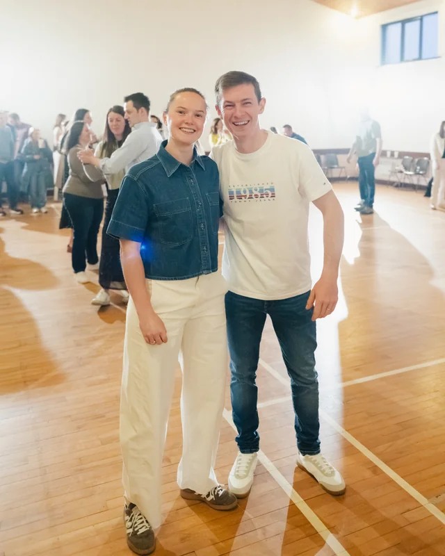 a man and a woman dancing in a dance floor