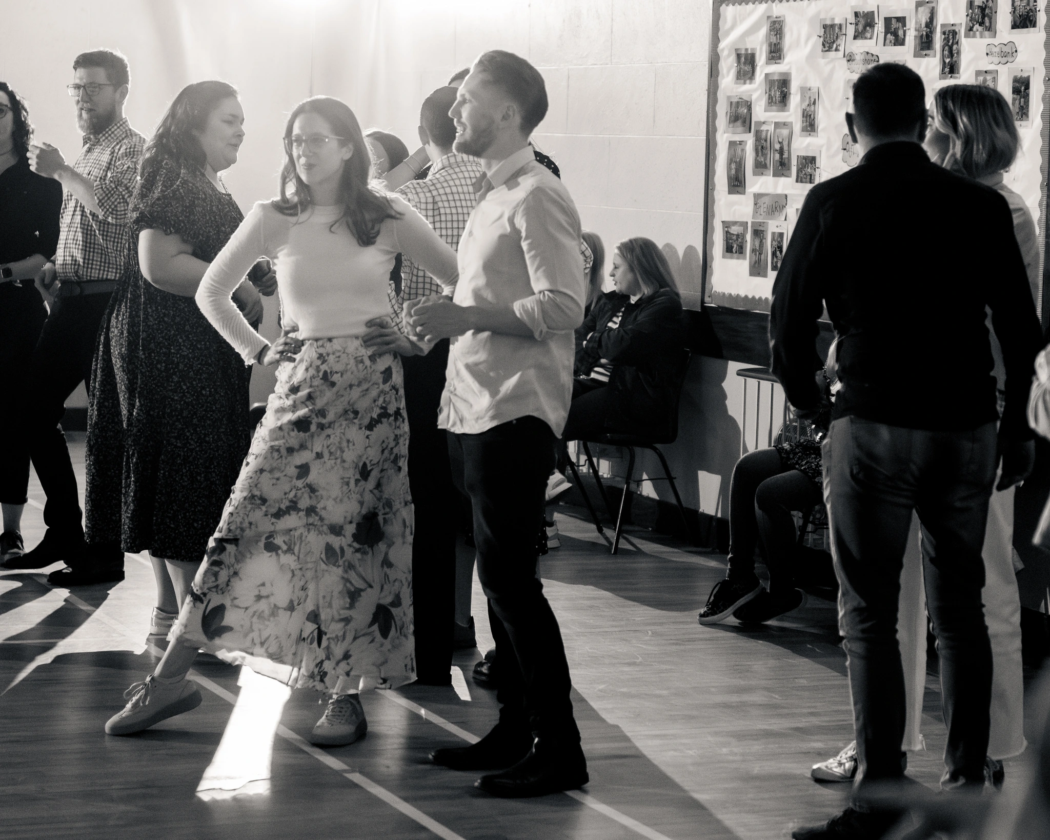 a group of people dancing in a room