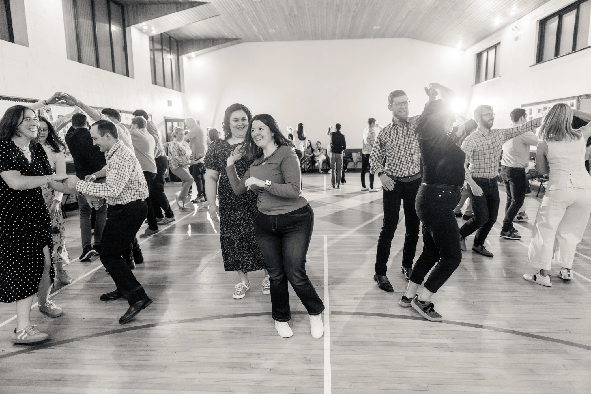 a group of people dancing in a dance floor