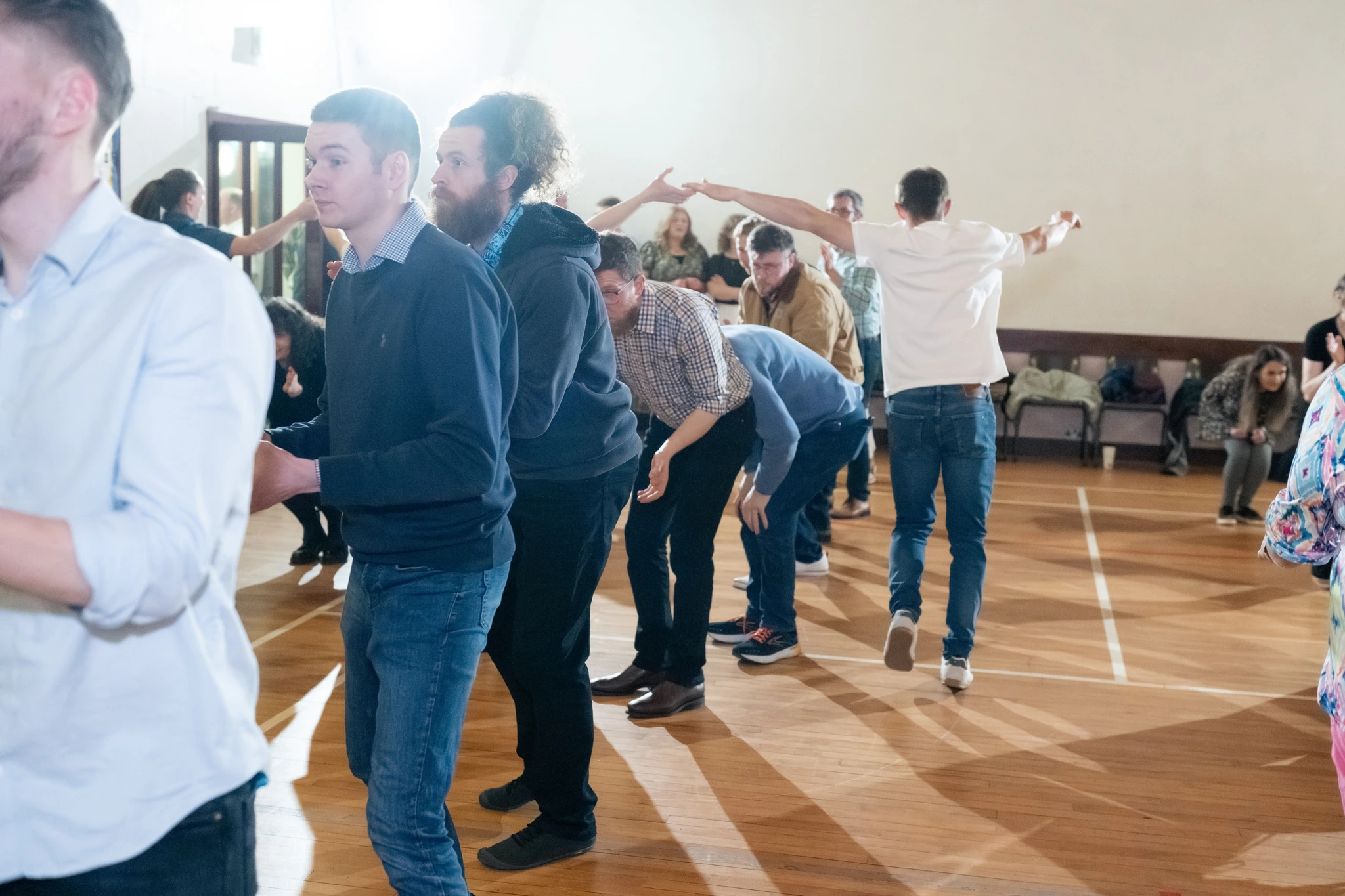 a group of people dancing in a room