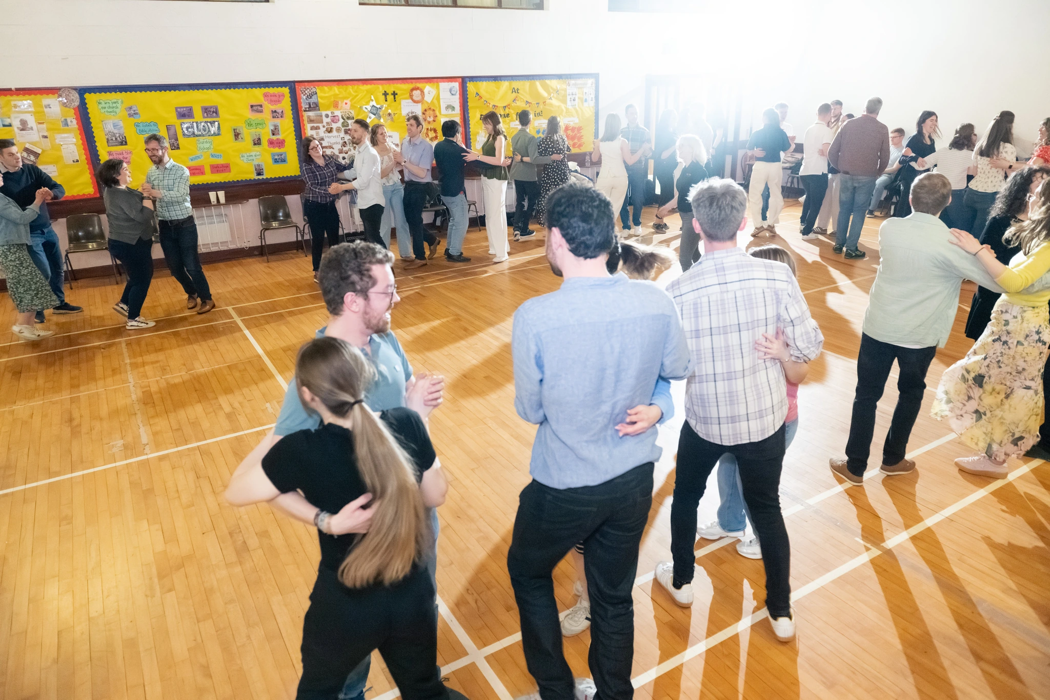 a group of people dancing in a room