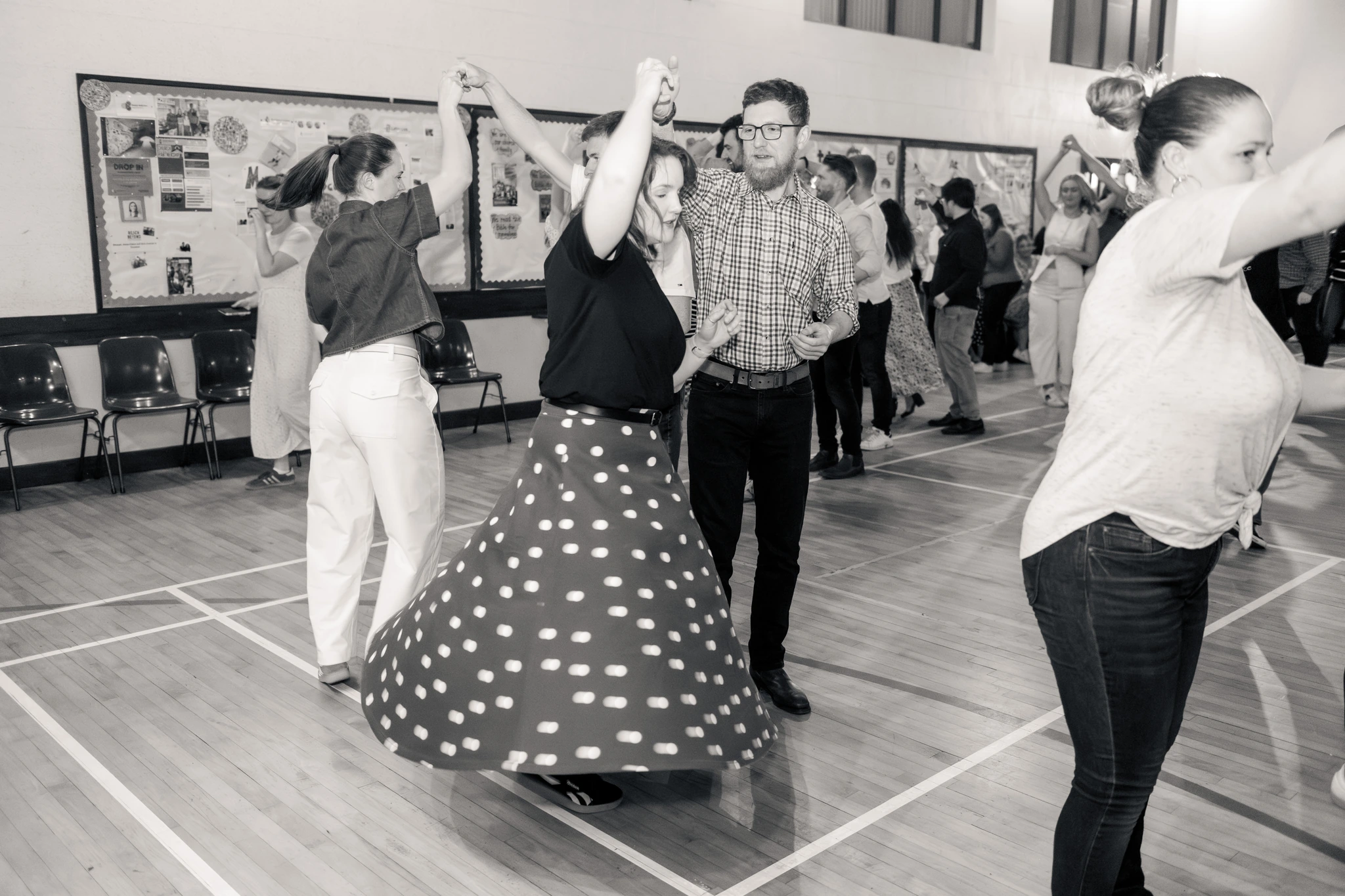a group of people dancing in a dance floor