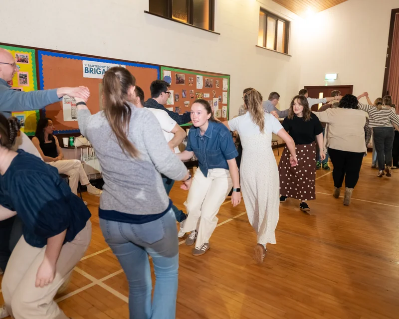 a group of people dancing in a room