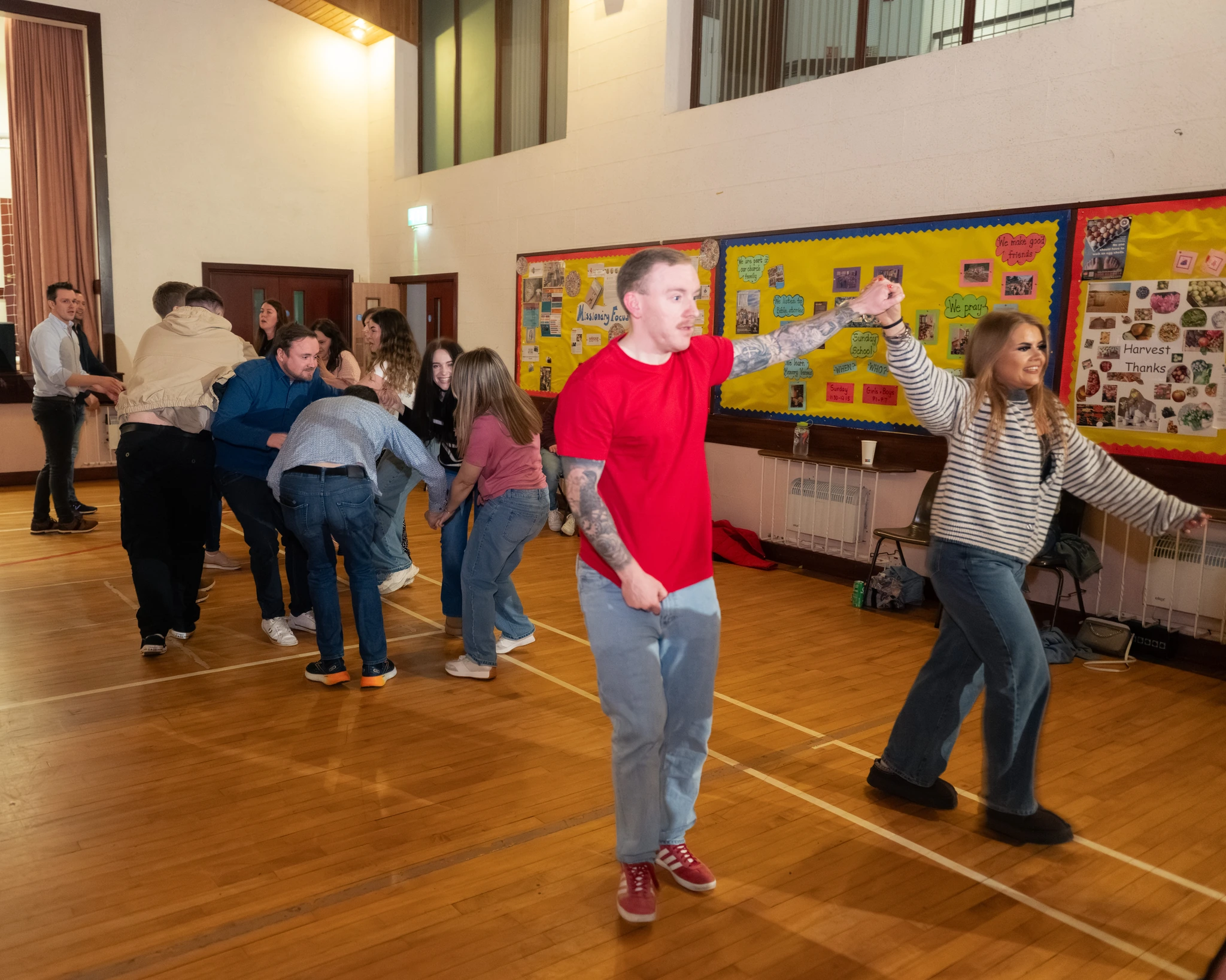 a group of people dancing in a room