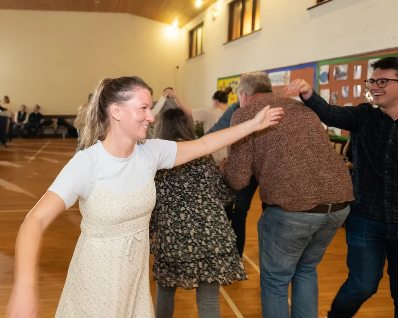a group of people dancing in a room