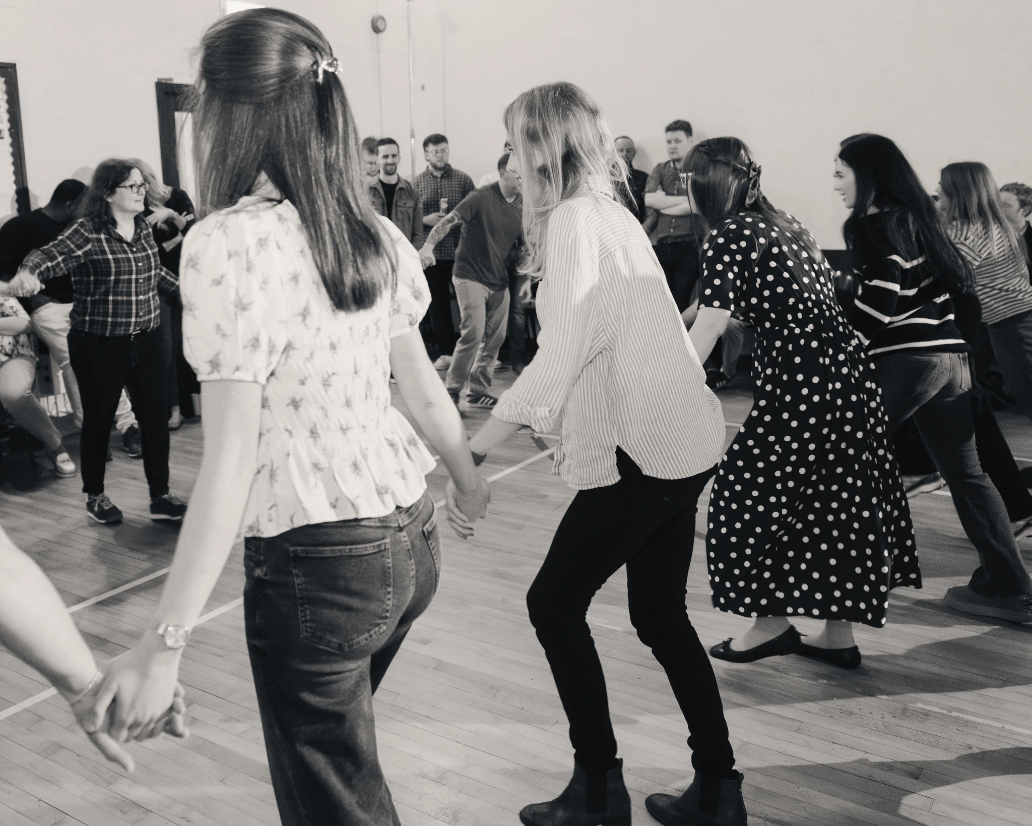 a group of people dancing in a room