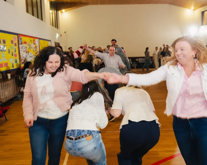 a group of women dancing in a gymnasium