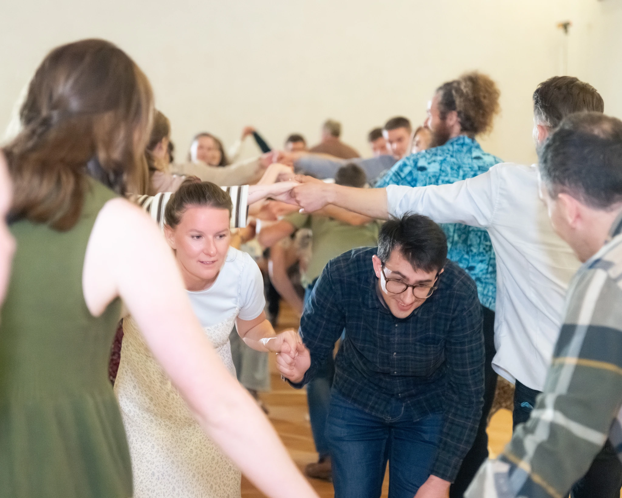 a group of people dancing in a circle
