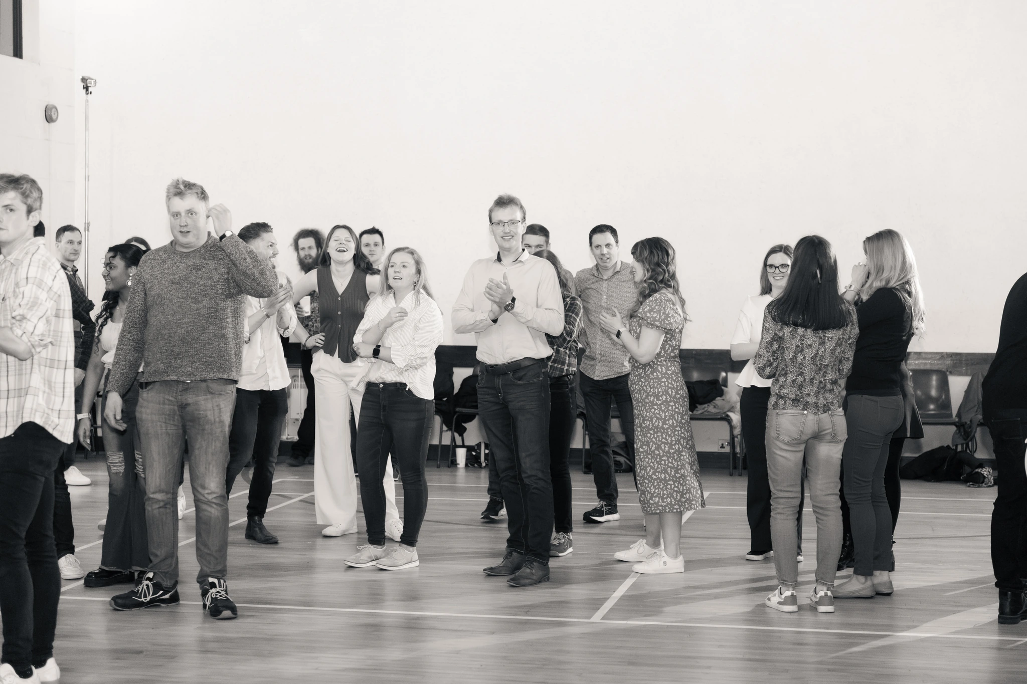 a group of people standing in a room