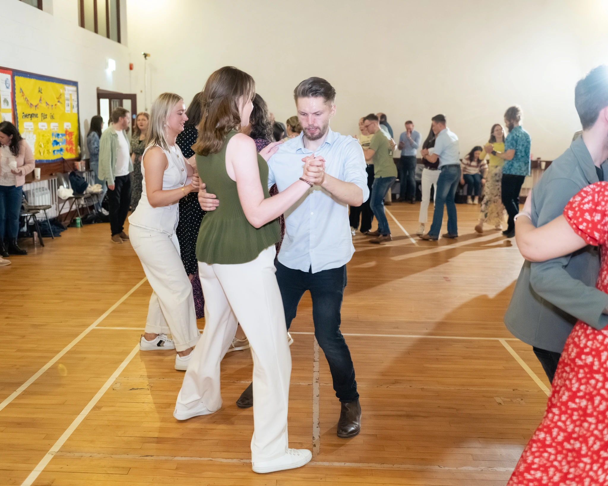 a group of people dancing in a dance floor