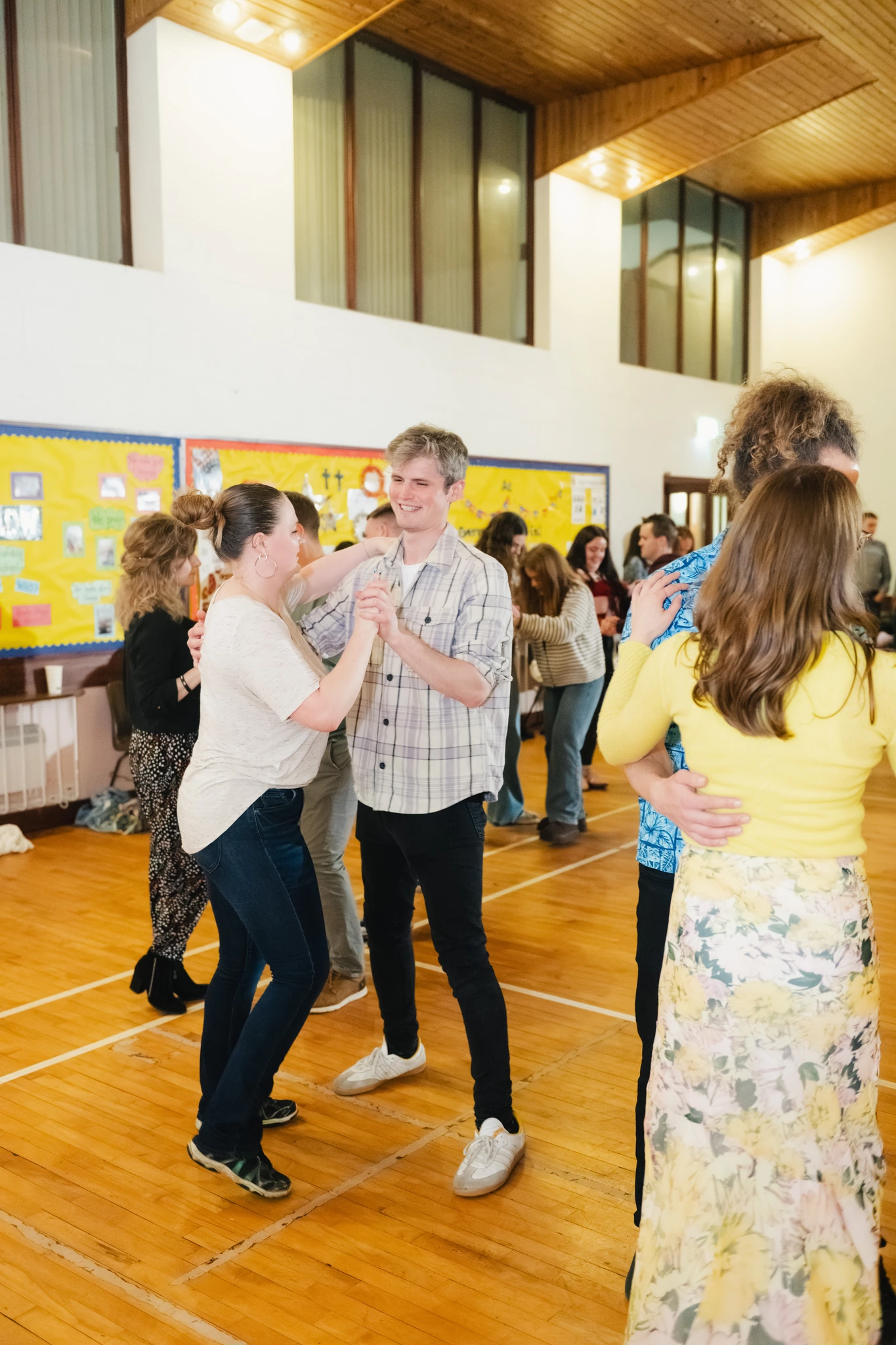 a group of people dancing in a room