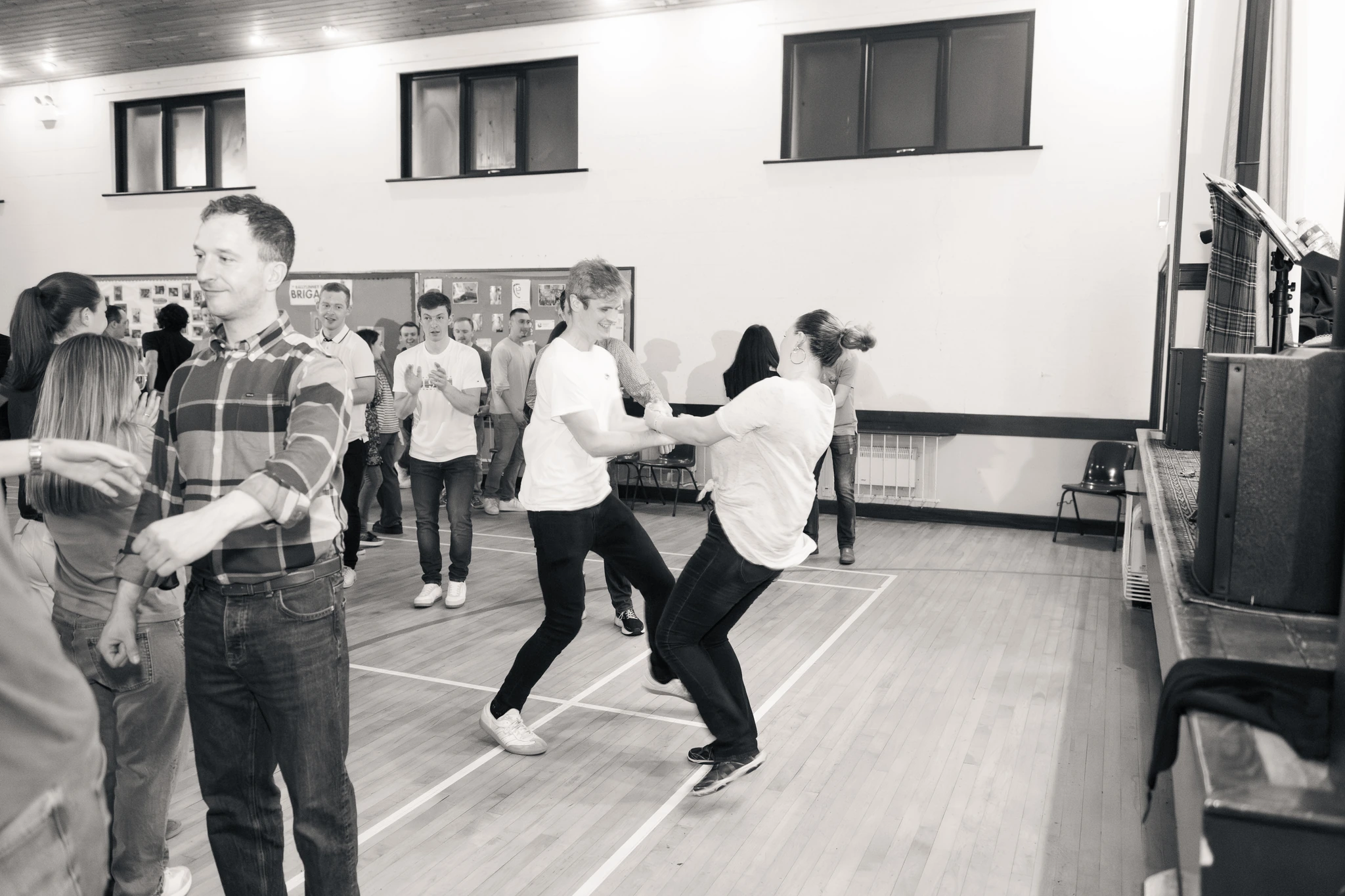a group of people dancing in a gymnasium