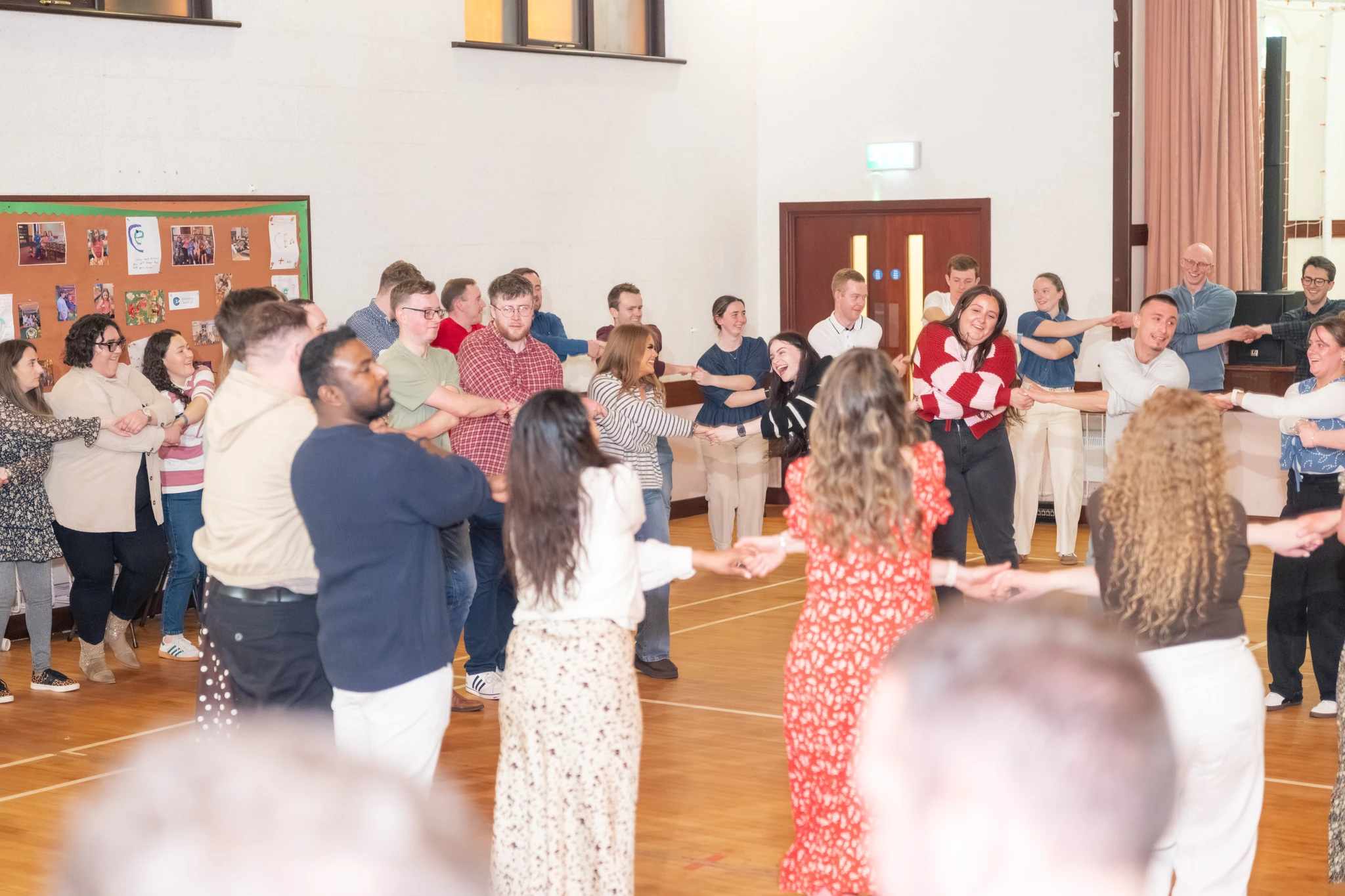 a group of people dancing in a circle