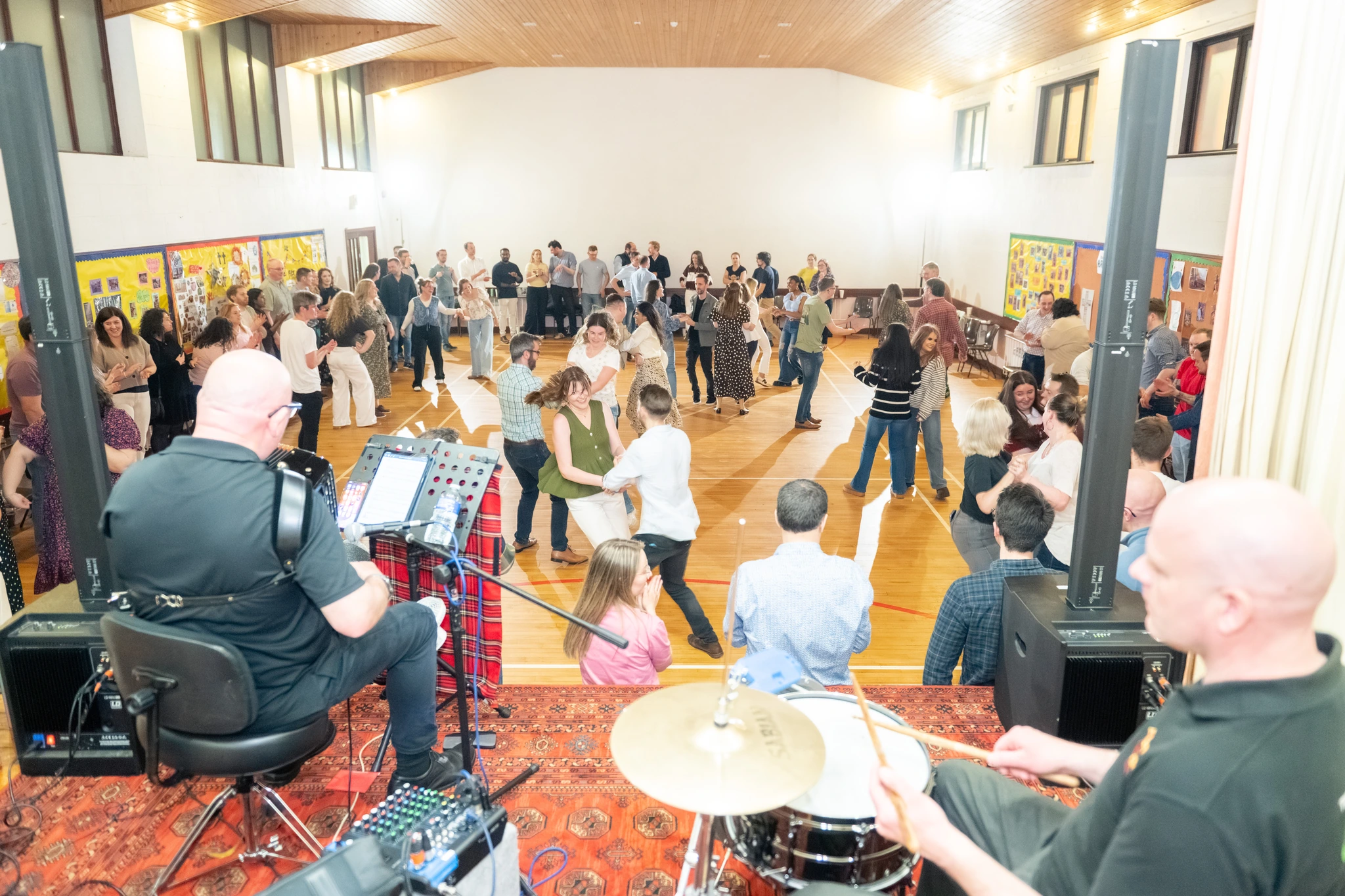 a group of people playing instruments in a room