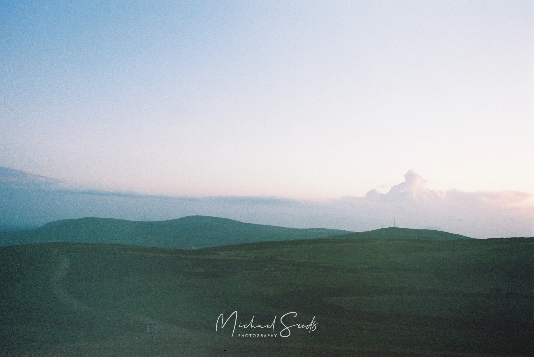 Shot on film from the summit of Divis, where the hills soften into dusk and the sky feels endless.