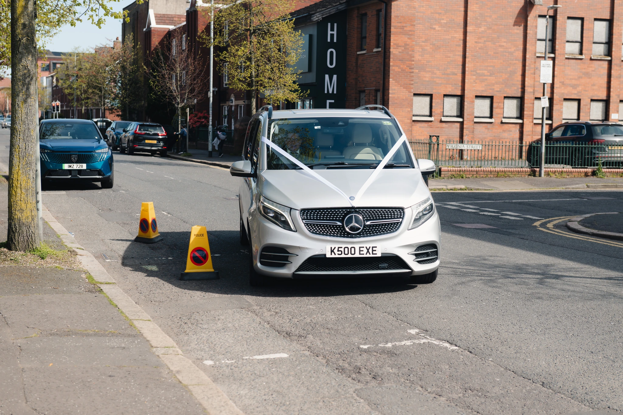a mercedes benz c class parked on the side of a road