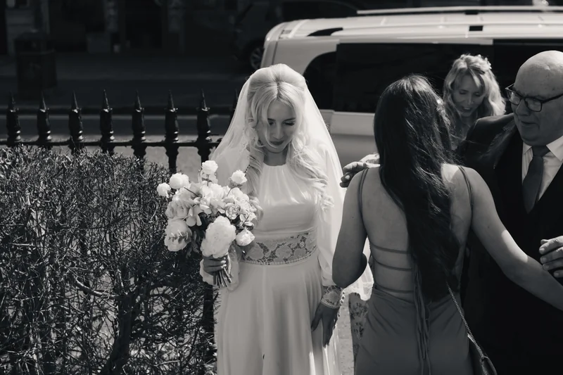a bride walks down the aisle of a church