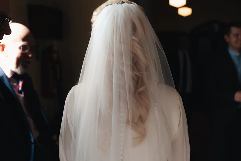 a bride walks down the aisle of a church