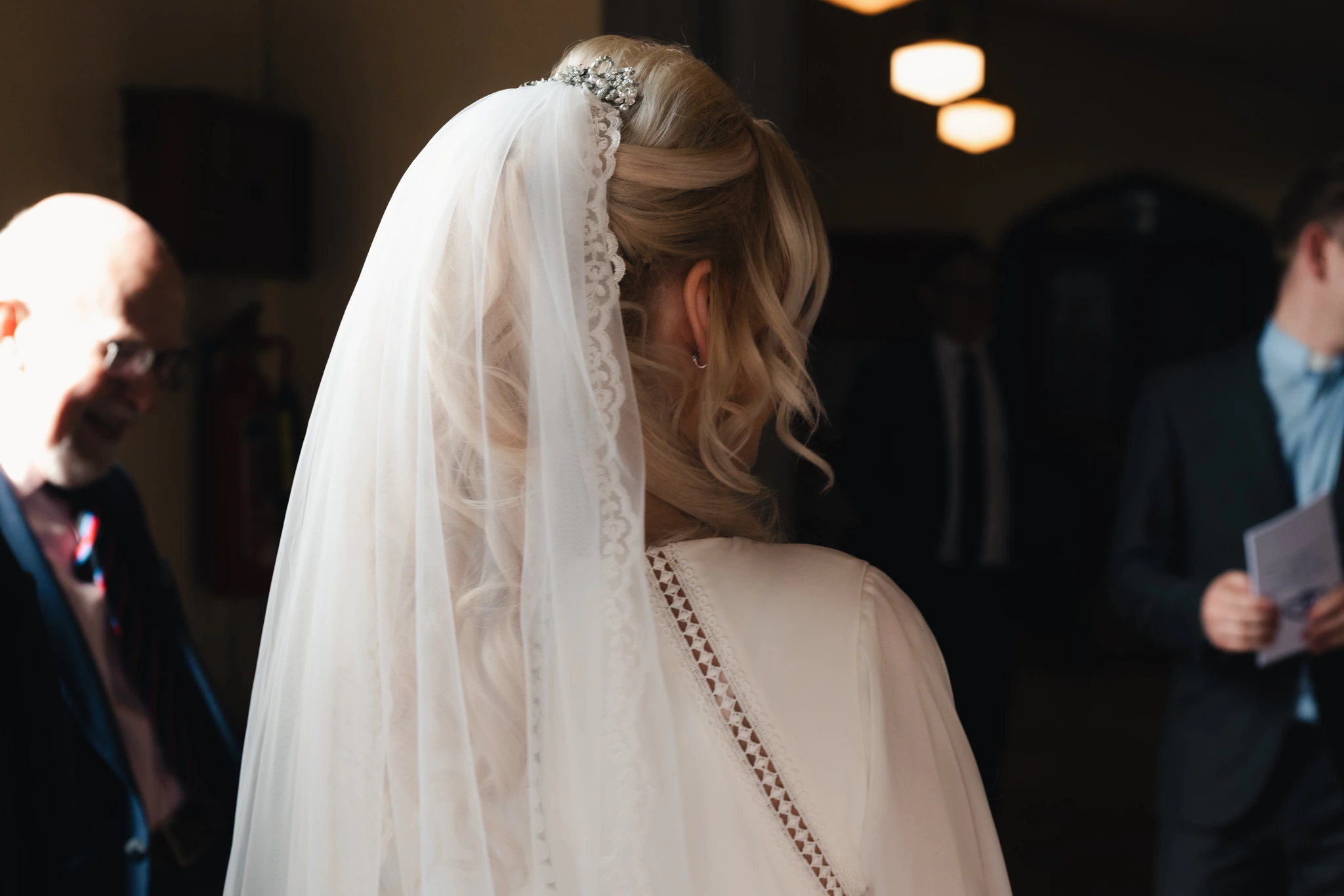 a bride walks down the aisle of a church