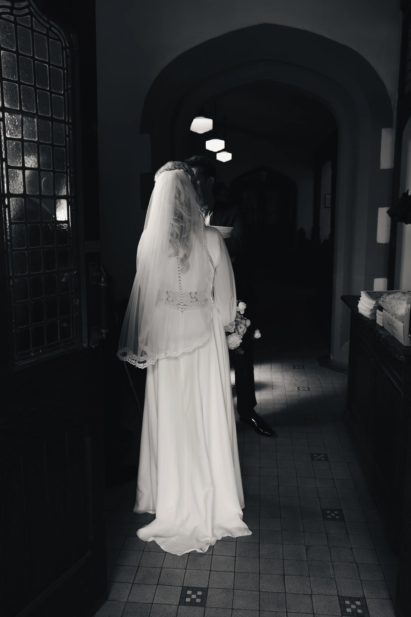 a bride walks down the aisle of a church