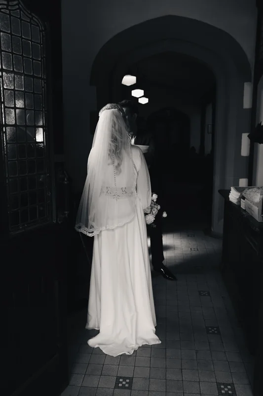a bride walks down the aisle of a church