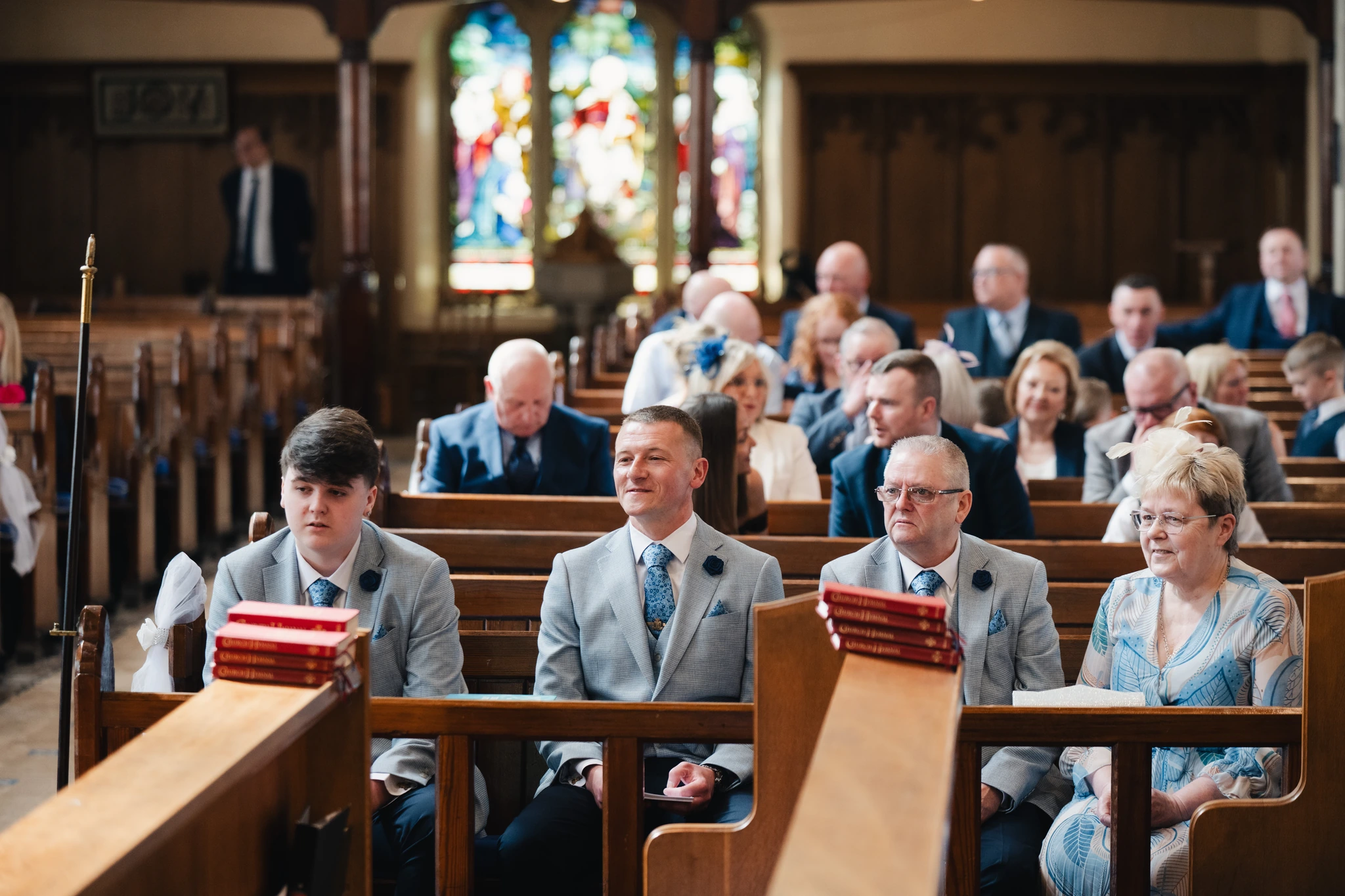 a bride and groom walk down the aisle of a church
