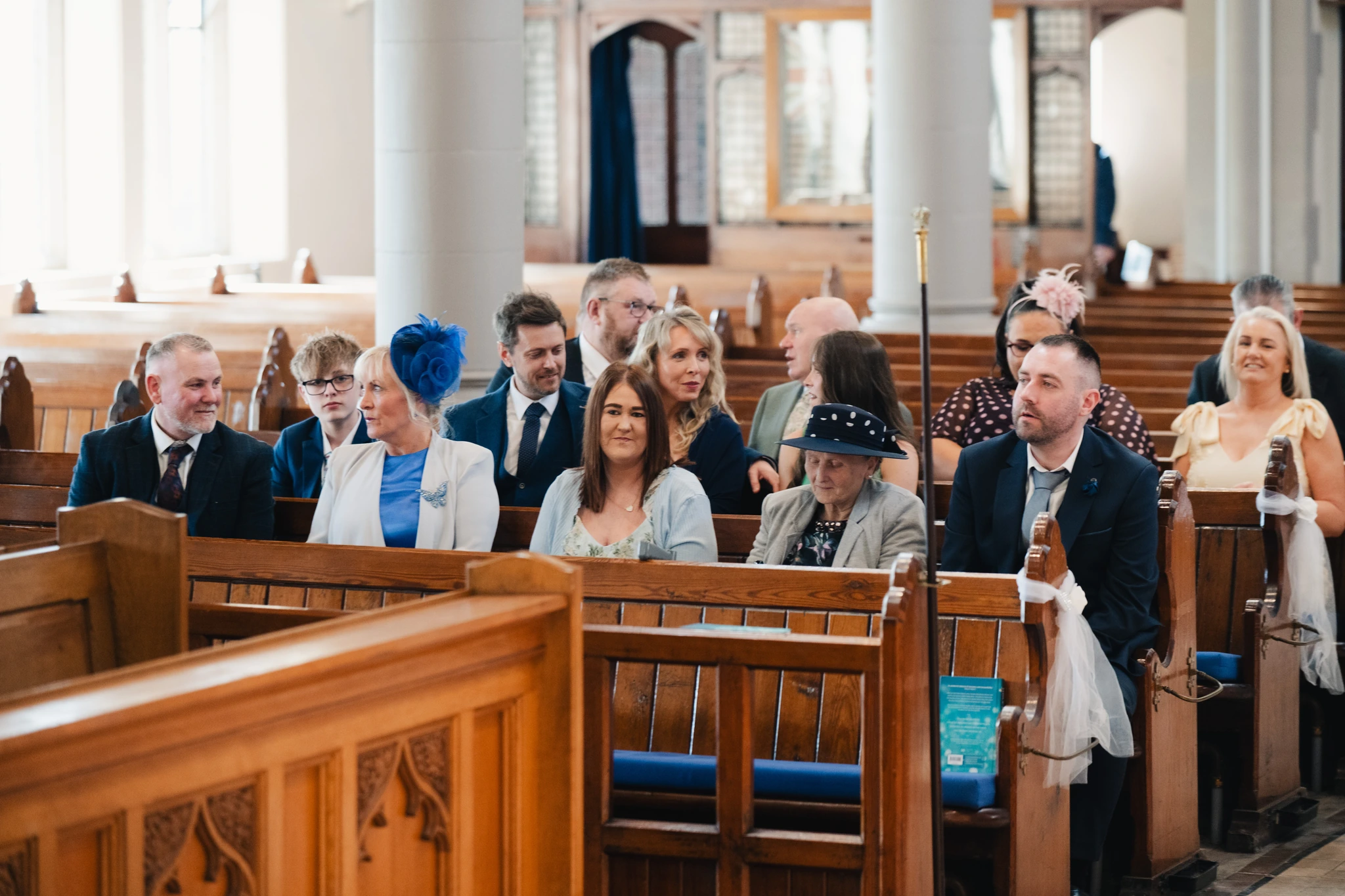 a bride and groom walk down the aisle of a church