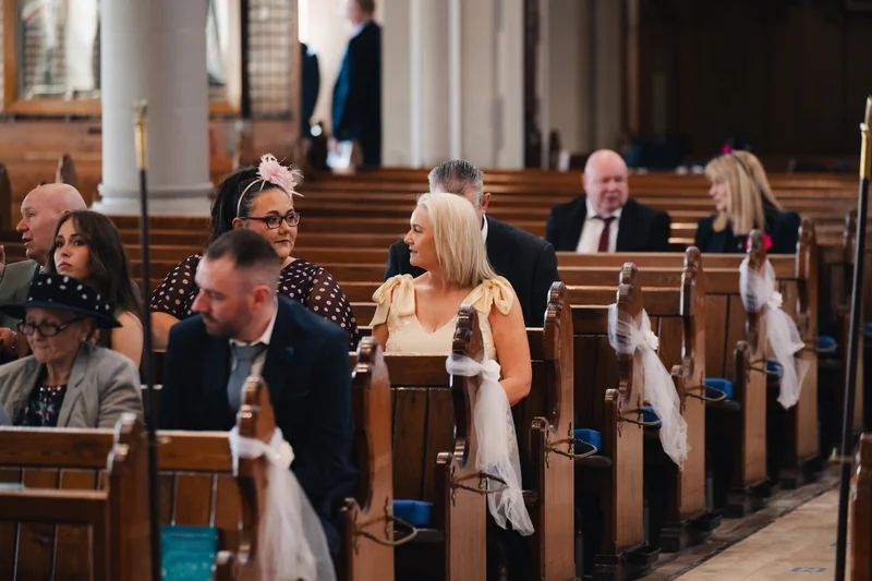 a bride walks down the aisle of a church