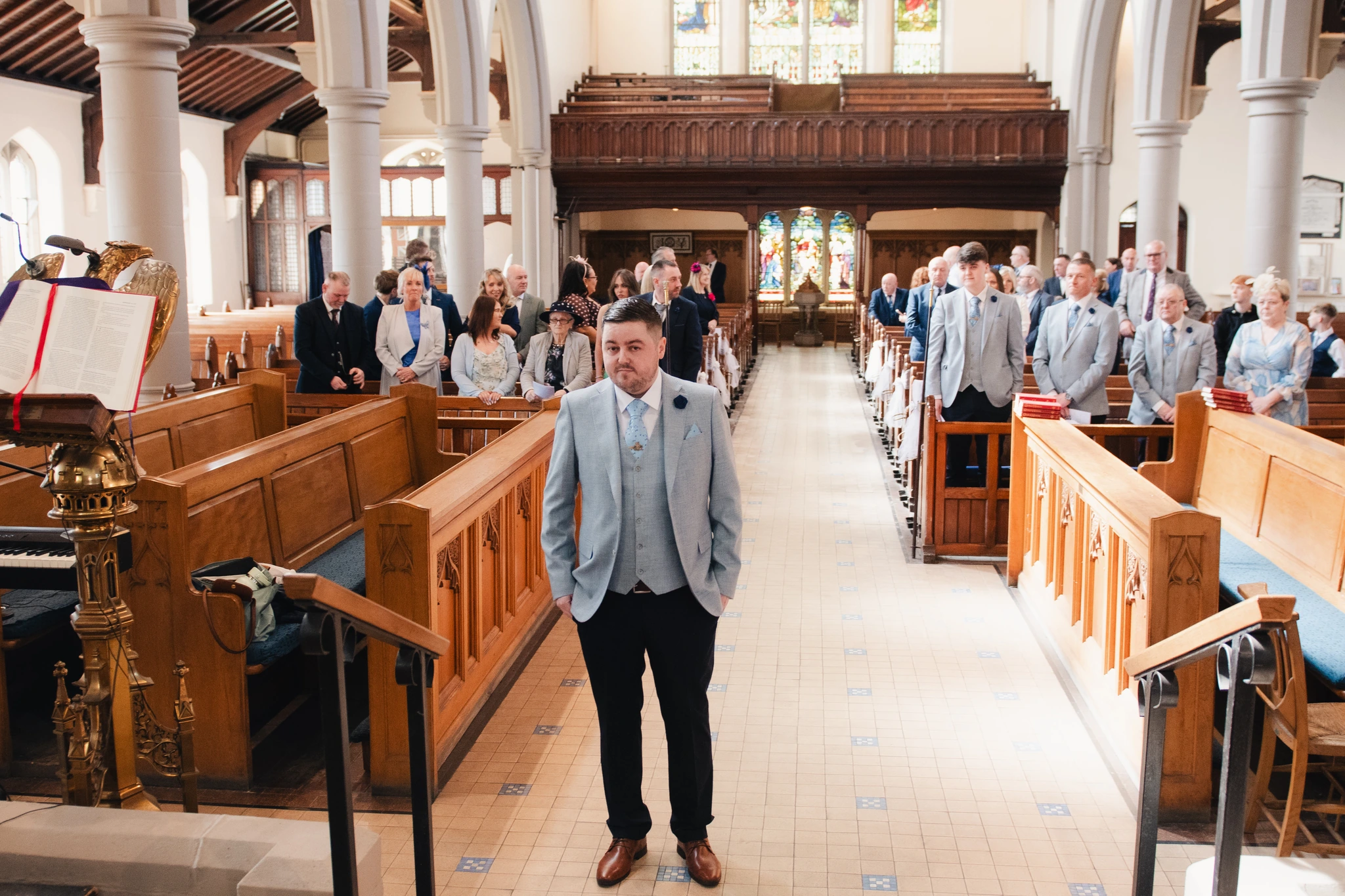 a bride walks down the aisle of a church