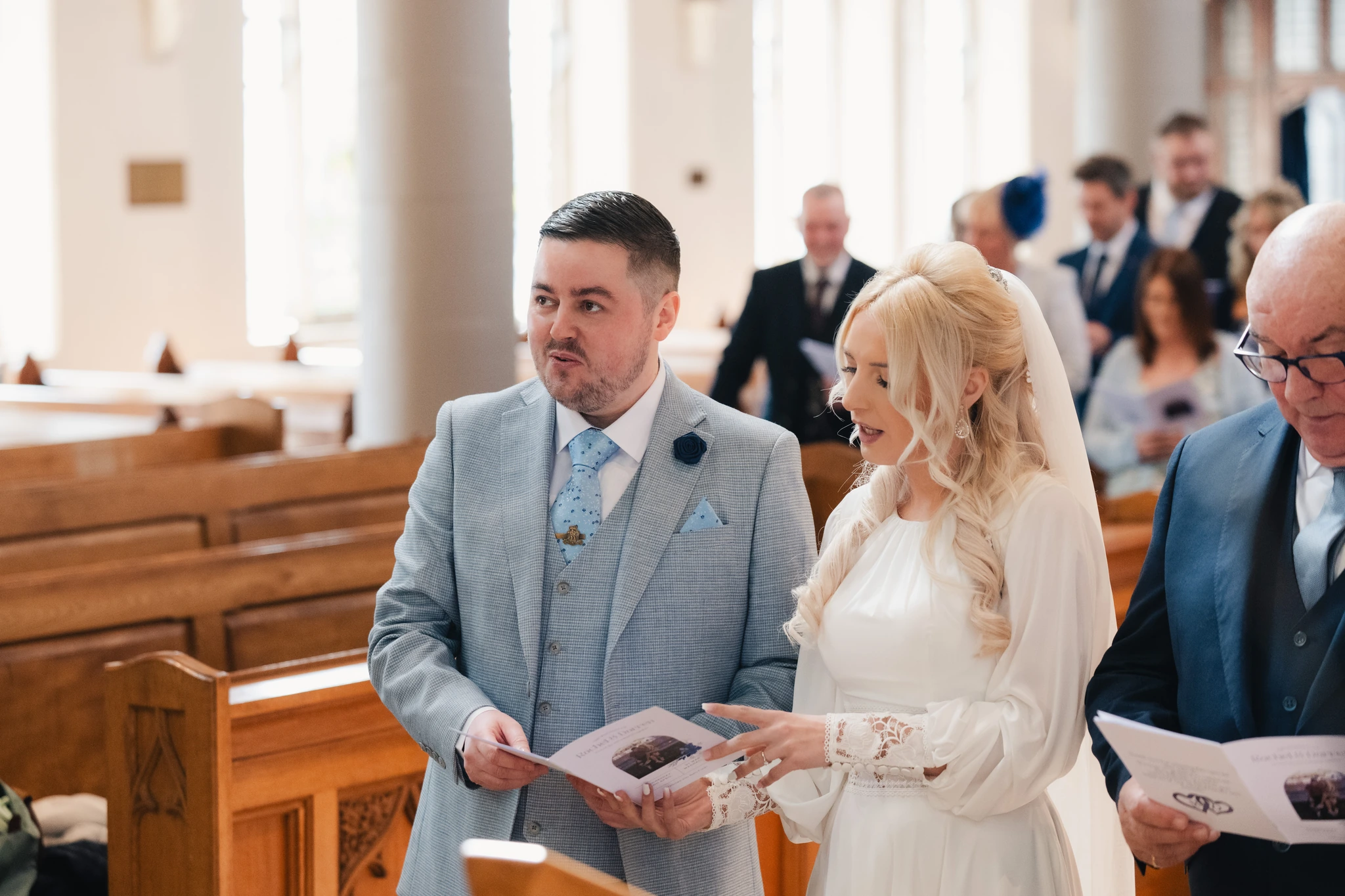 a bride walks down the aisle of a church