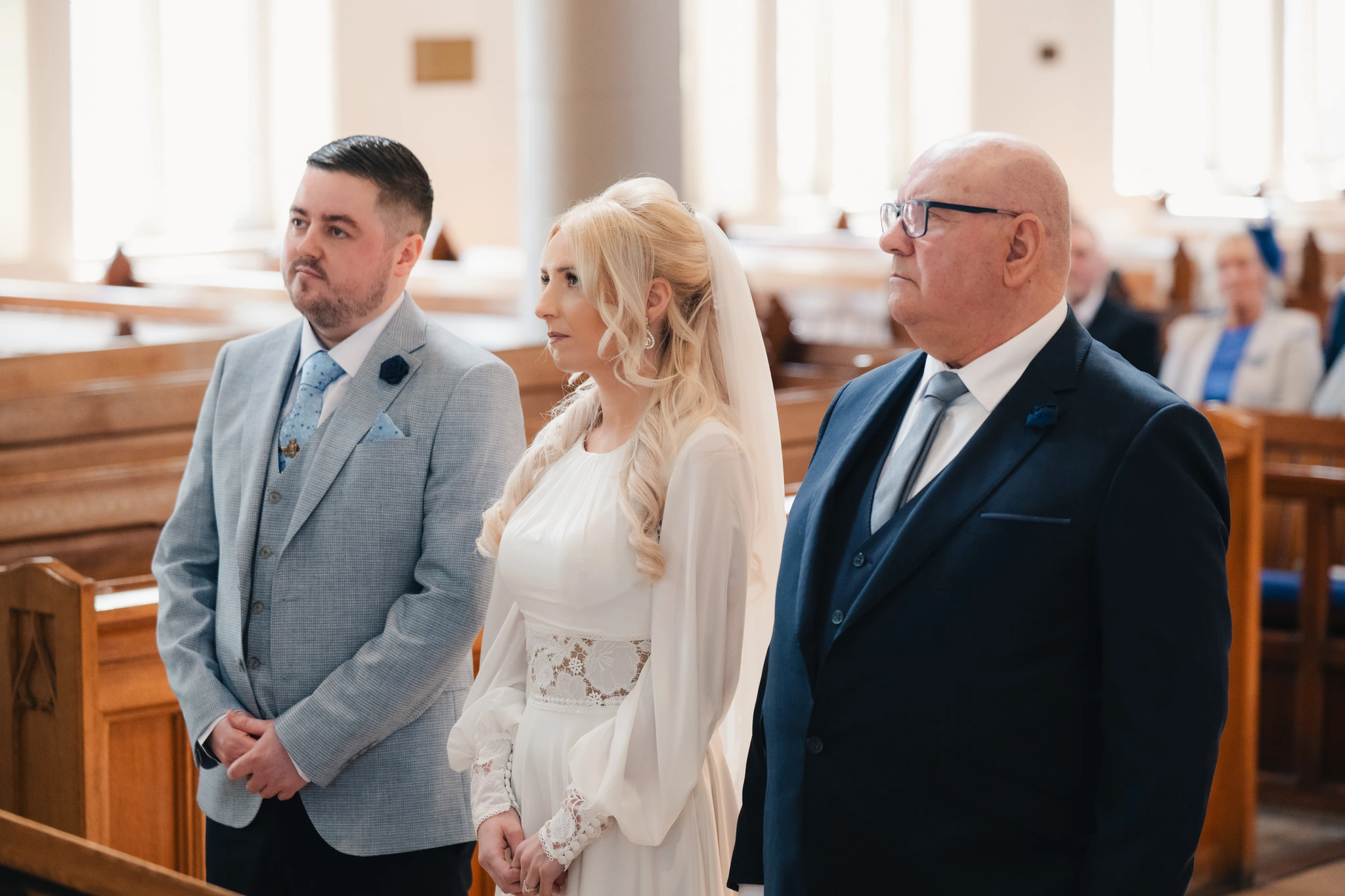 a bride walks down the aisle of a church