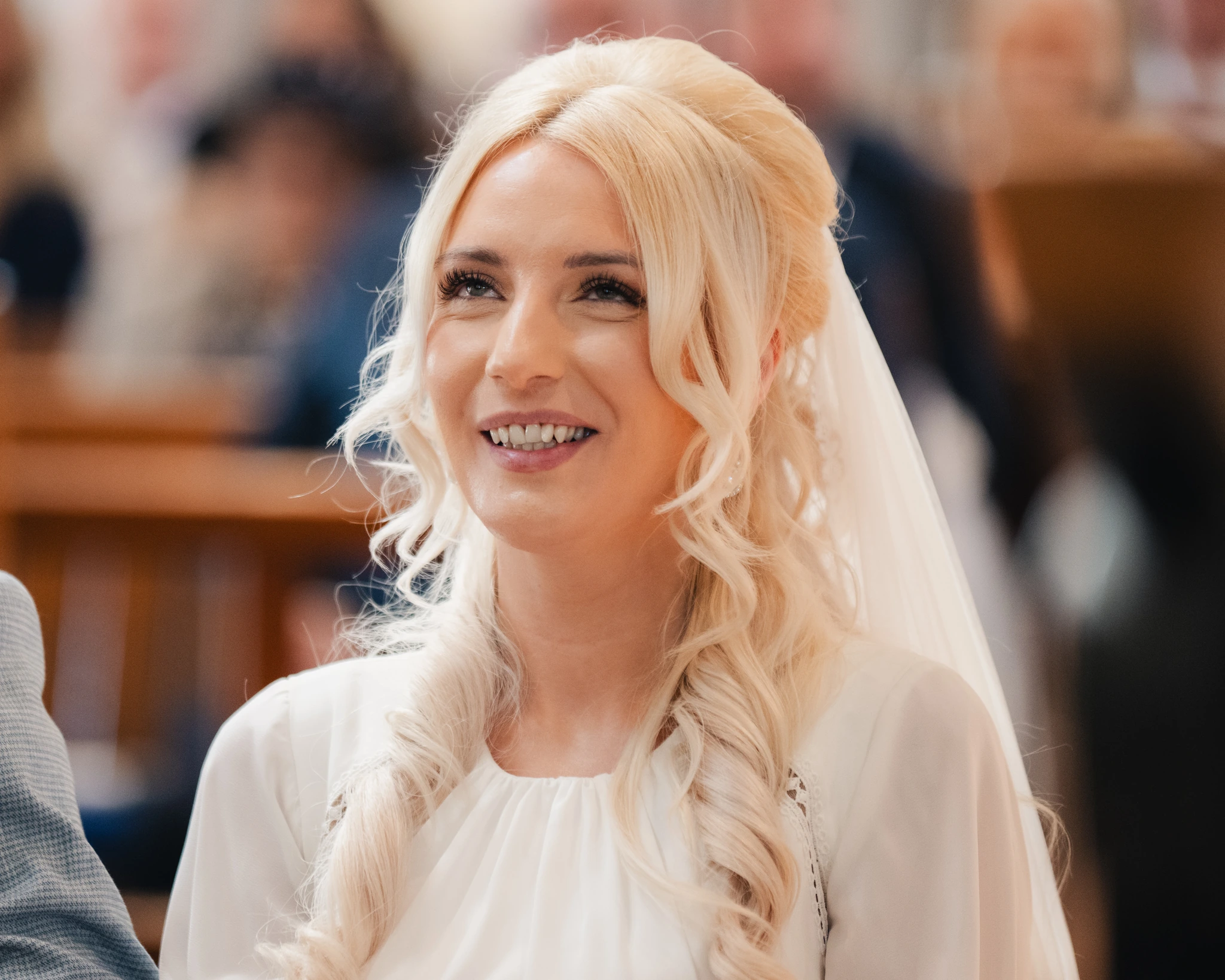 a bride and groom smile at the end of their wedding ceremony