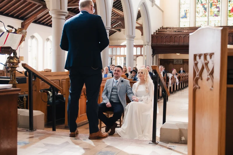 a bride walks down the aisle of a church during her wedding ceremony