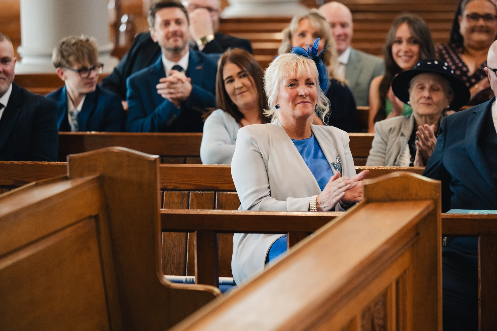 a bride walks down the aisle of a church