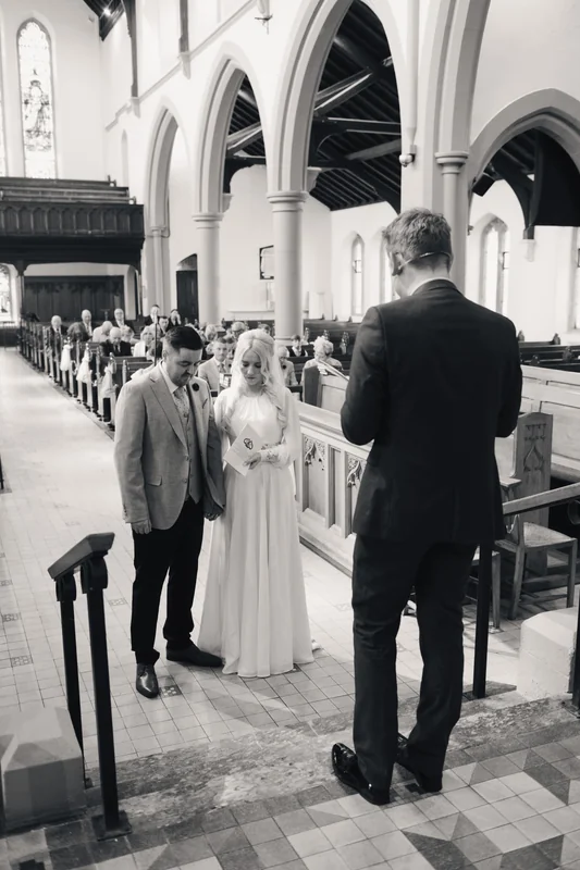 a bride walks down the aisle of a church
