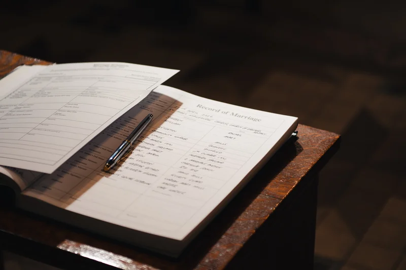 a notebook on a table with a pen on it