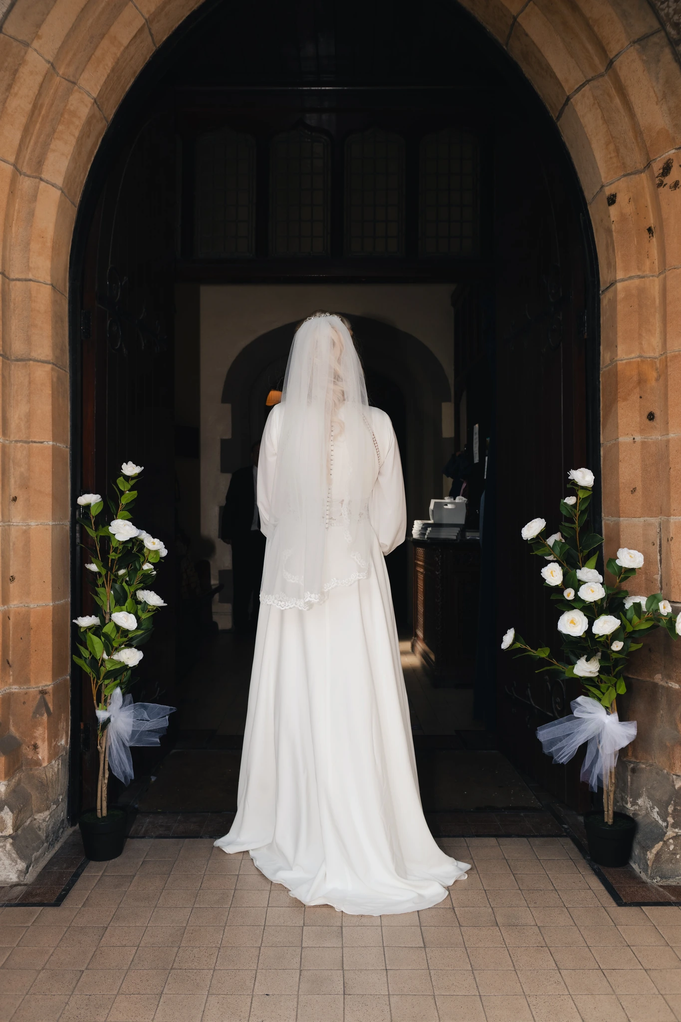 a bride walks down the aisle of a church