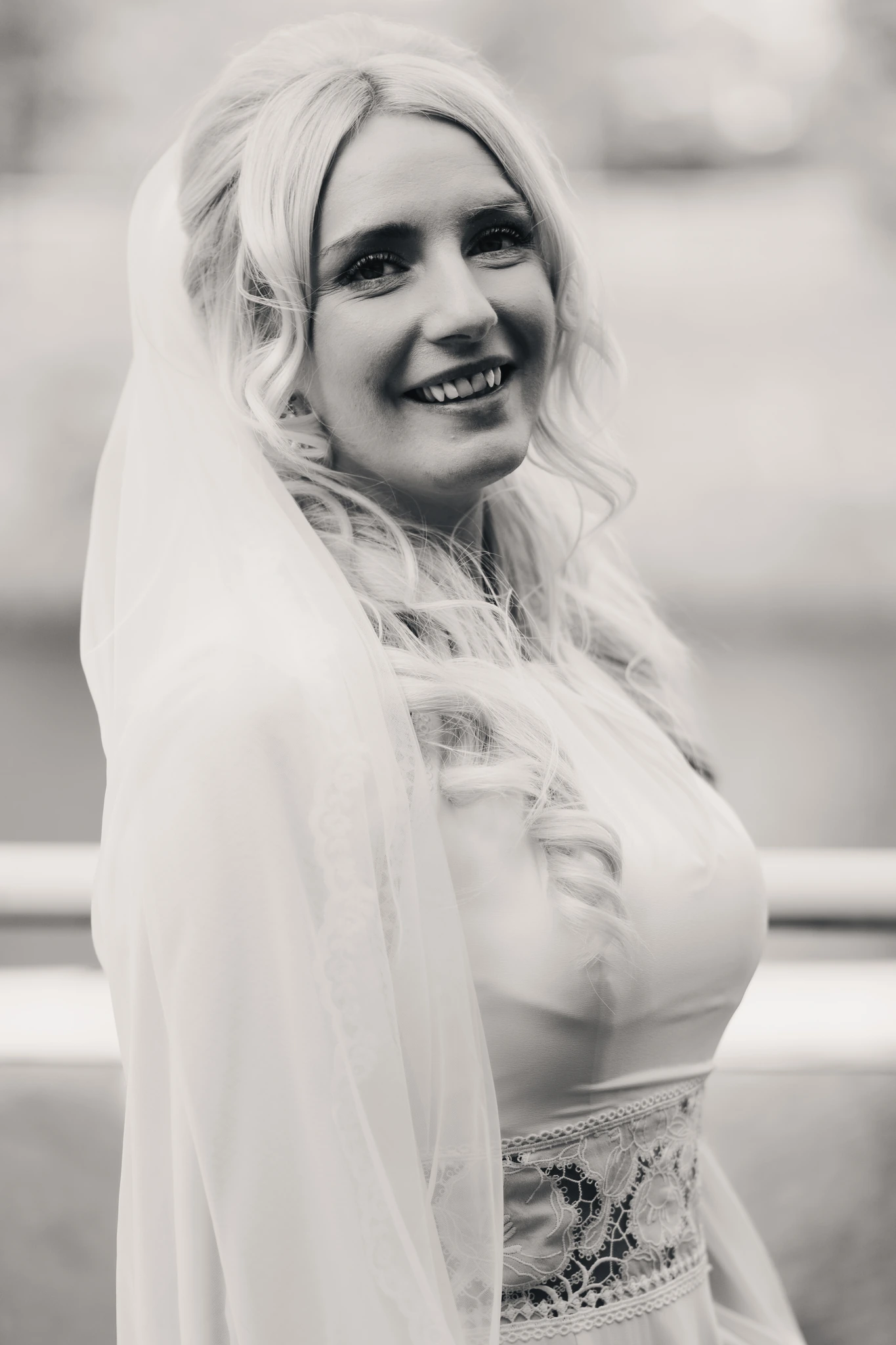 a bride in a wedding dress with a veil and tiara