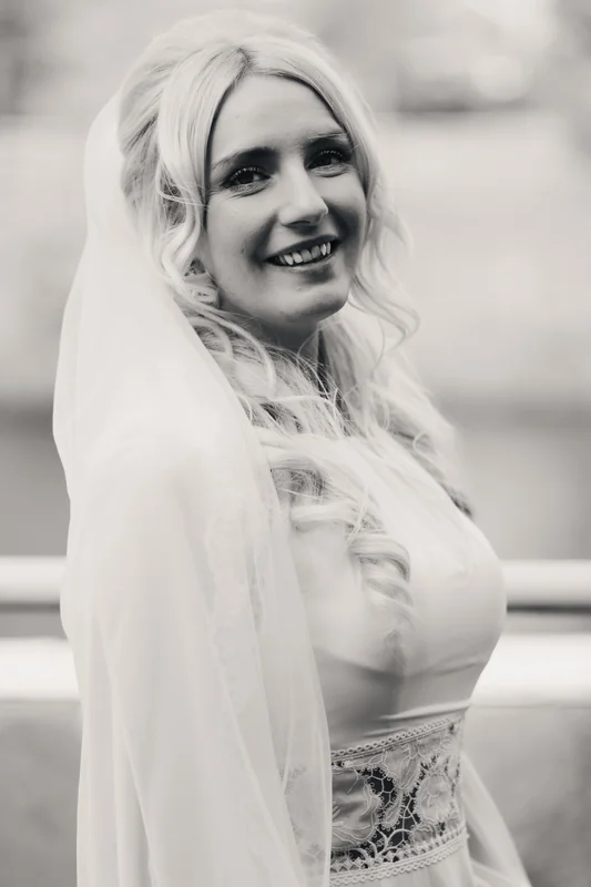 a bride in a wedding dress with a veil and tiara