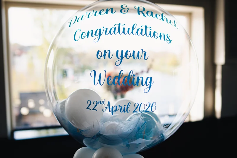 a clear balloon with the words congratulations on your wedding
